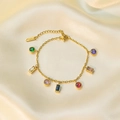 Gouden roestvrijstalen ketting met gekleurde zirkoonhangers op zijden textuur - E233 Armband Goud Kleurrijke Ketting