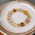 Detail of beaded bracelet with yellow crystal beads and gold spacers on a ceramic plate - Citrine Golden Metal Spacer Style (35#)