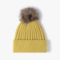 Winter mustard yellow ribbed knit beanie featuring a fluffy dark brown faux fur pom pom - One Size / Ginger Yellow