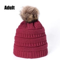 Detail of wine red knit beanie for adults with premium fluffy faux fur pom pom - Burgundy