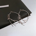 Minimalist silver bow knot hoop earrings in polished finish on black leather base - Silver Large Bowknot