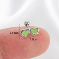 Silver cartilage stud earring with two green heart crystals shown on fingertip - Silver-Lime Heart