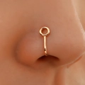 Macro shot of rose gold U-shaped non-piercing nose clip on model's face - KC Gold Small Round Style (G-097)