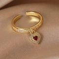 Macro shot of gold ring with square zircons and a red heart-shaped pendant detail - Adjustable Open / 9# Gemstone Heart (Champagne Gold)