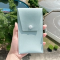 Mini 8-piece makeup brush set in light blue textured leather pouch with snap closure - Storage Pouch / Cyan
