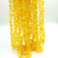 Macro shot of irregular natural yellow citrine stone chips for DIY jewelry making - Yellow Jade approx 80cm