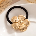 Elegante goma para coleta con diseño de flor dorada texturizada en color negro - Dorado - Flor de Cinco Pétalos
