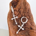 Sparkling cross drop earrings with silver finish and pavé crystals on a wooden pedestal - White Gold Pave Huggie Cross