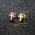 Minimalist rose gold cross stud earrings shown in a detailed close-up shot with dimensions - Cross / Rose Gold