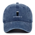 Detail of Vitamin G embroidery on washed navy denim baseball cap with vintage texture - Navy Blue