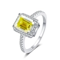 Detailed macro view of an emerald-cut yellow moissanite ring set in polished silver S925 - Lemon Yellow