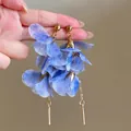 Close-up of blue raffia flower drop earrings with gold bar detailing. - Silver Needle Style (21#)