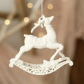 White glitter rocking reindeer Christmas tree ornament with elegant bokeh background lights - Flying Deer