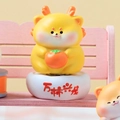 Cute dragon capybara figurine holding an orange persimmon on a decorative base - A181 Persimmon Dragon