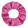 Close-up of a glossy pink satin scrunchie showing smooth silk texture and soft folds - Rose Pink