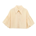 Detail of short puff sleeves and large lapel collar on this cream button-up cropped shirt - Apricot
