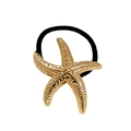 Macro shot of gold starfish alloy hair tie with detailed texture and black elastic cord - Starfish