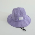 Close-up of purple quick-dry bucket hat featuring a heart patch and adjustable chin strap - 52cm / Purple