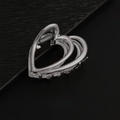 Minimalist silver heart-shaped metal hair claw clip for women on leather background - Double Heart / Silver