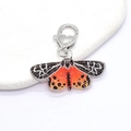 Detail of colorful butterfly keychain with orange acrylic wings and heart lobster clasp - Black & Orange Butterfly (Heart Clasp)