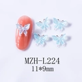 Macro detail of 11x9mm blue resin butterfly nail art charm with shimmer and pink accents - Light Blue Pink Center Butterfly (L224)