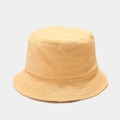 Close-up detail of light orange bucket hat showing soft terry cloth fabric texture - M / Yellow