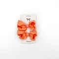 Close-up of orange grosgrain ribbon bow clips on white fashion display card - 2 Pcs/Set / Orange