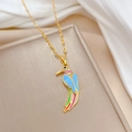 Macro view of luxurious gold hummingbird necklace with colorful enamel and inlaid diamonds - Blue Hummingbird (E321)
