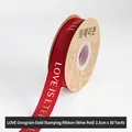 2.5cm wine red grosgrain ribbon with gold Love is Eternal lettering in a 30-yard roll - 2.5cm Wide x 30 Yards Long / Burgundy