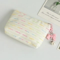 Cream woven coin purse with colorful stitching and a pink bow pearl charm - White
