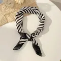 Elegant black and white diagonal striped silk scarf tied in a stylish knot design - 70-208 Black