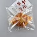 Realistic croissant model with nuts inside a transparent PVC self-sealing storage bag - Zip Lock Bag 20*20cm - 26 Silk