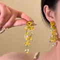 Detail of yellow flower beaded tassel earrings featuring tiered design and bohemian summer style - Bright Yellow Beaded Flower Style (16#)