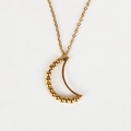 Rotating golden crescent necklace with anxiety relief beads in a smooth metallic finish - Abstract Moon Necklace / Gold