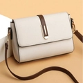 Chic beige crossbody bag with brown leather accents and gold buckle details for women - White