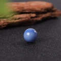 16mm round blue gemstone sphere ornament with a smooth polished finish on dark texture - Blue Aventurine