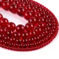 Macro shot of assorted sizes red translucent round stone beads for jewelry making - Garnet Red Glass Beads