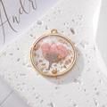 Round resin pendant featuring real pink dried daisy and gold leaf in copper frame - Gold Foil Pink Flower