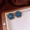 Macro shot of vintage blue star earrings with rhinestones in a velvet jewelry box - Silver Earring Post-Black