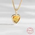 Macro detail of heart-shaped yellow topaz pendant in 925 sterling silver with gold finish - Gold-Yellow Zirconia / 925 Silver