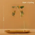 Golden rotating candle holder with bicycle couple charms on minimalist warm background - Magnetic Cycling Couple (No Tray)