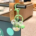 DIY Mickey shaped green liquid glitter keychain with forest green bell and leather strap - Green Mickey Head Sparkle