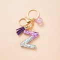 Letter Z resin keychain with pink glitter, purple tassel and golden metal keyring - Letter Z
