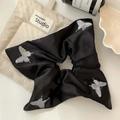 Detail of black silk scrunchie featuring silver butterfly embroidery and lace edges - Butterfly Embroidered Style