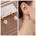 Detail of gold titanium steel hoop earrings with white pearls on a model and in a box - 7# Hoop Pearl