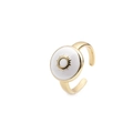 Detailed macro of gold-plated adjustable ring featuring white enamel sun pattern - Adjustable Open / Sun White