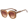 Chic leopard print sunglasses with brown gradient lenses shown from a side angle - Tea Tortoise Frame Gradient Tea Lens