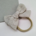 Infant muslin cotton bow headband in beige color with elastic nylon band for baby girls - White Khaki
