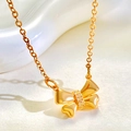 Close-up of golden bow pendant necklace with sparkling cubic zirconia inlay detail - Gold Rhinestone Bowknot Necklace (3750)