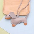 Detail of cute grey leather dachshund charm with orange accents and long lanyard strap - Dachshund / Gray